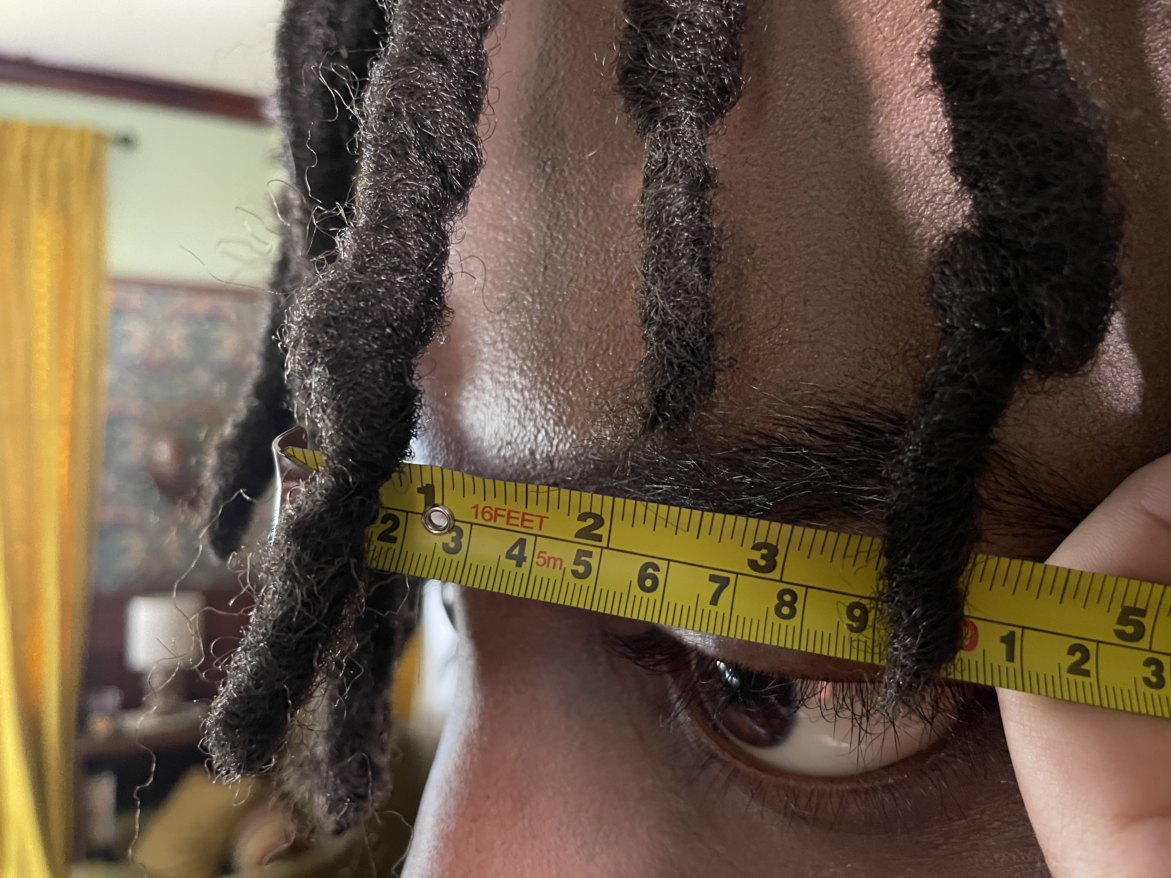 On set with Cootie, tape-measure forced-perspective rig